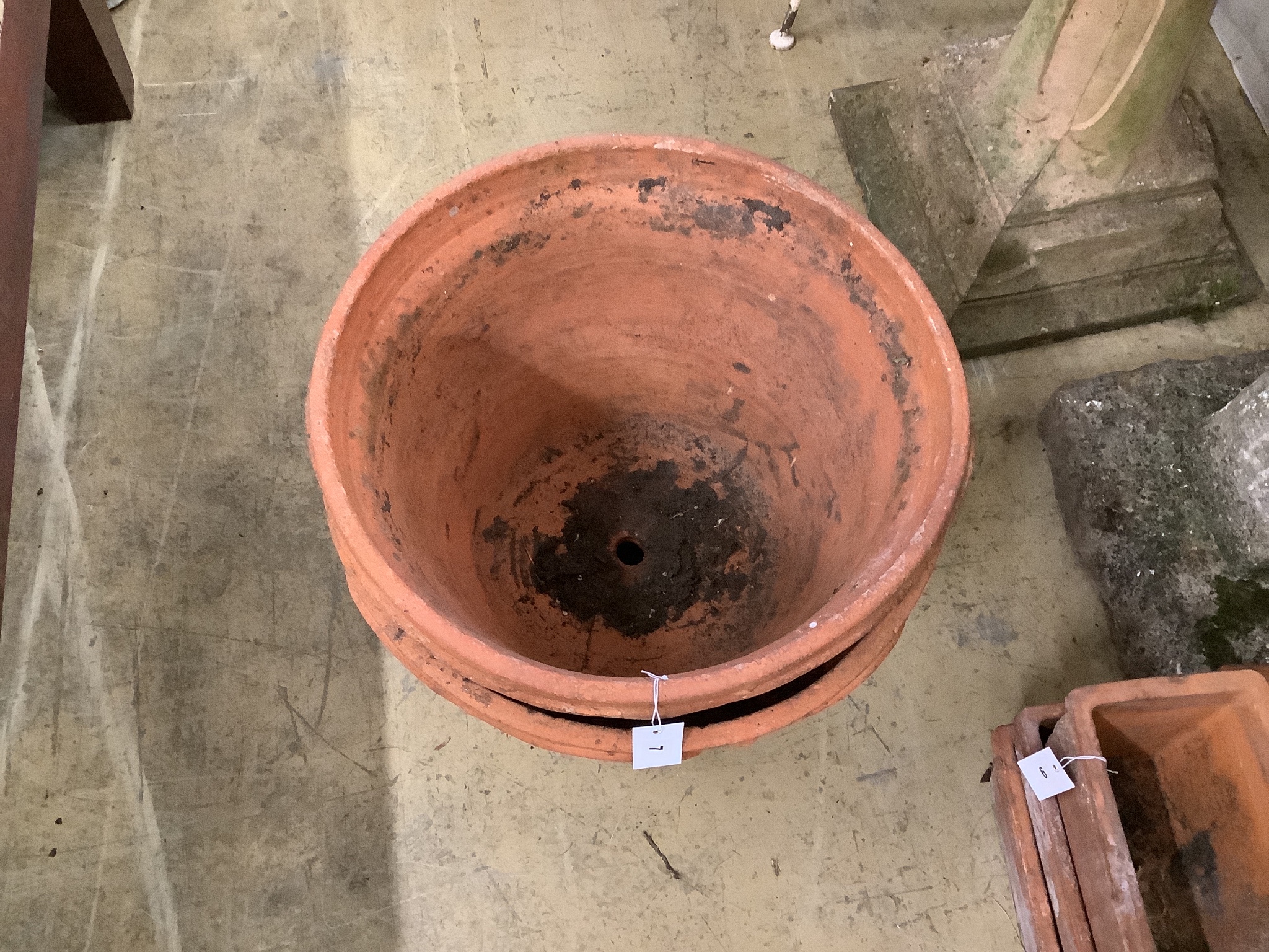 A pair of circular terracotta garden planters, diameter 51cm